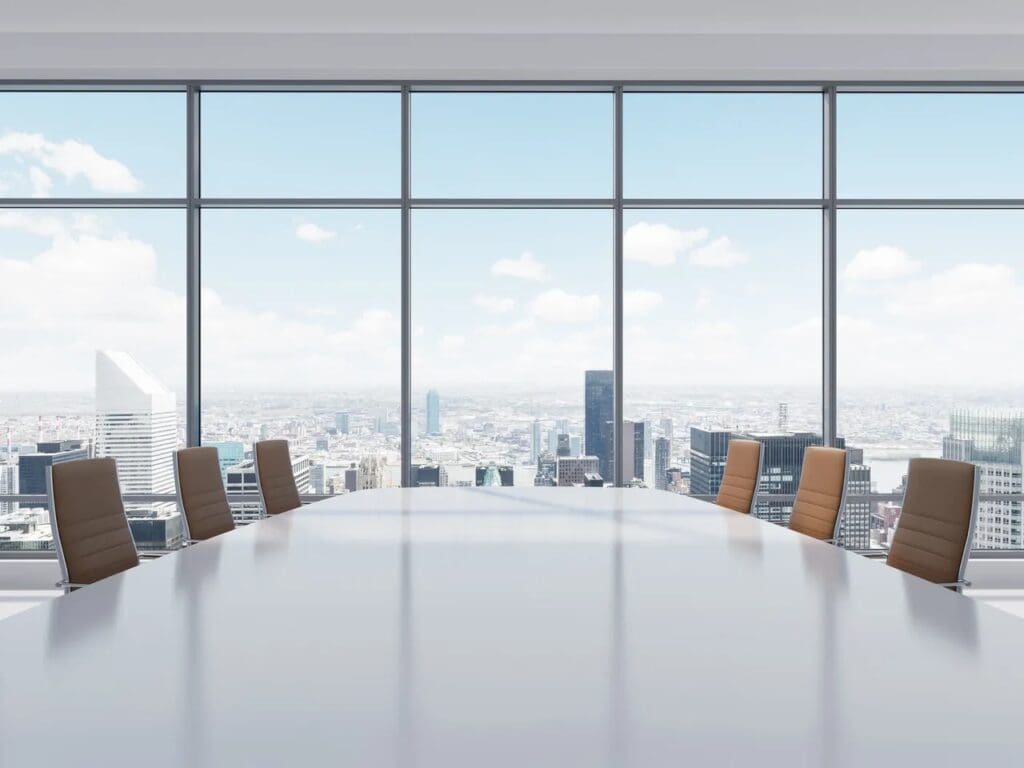 A conference room with a view of a city.