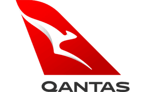 A qantas logo is shown on the side of an airplane.